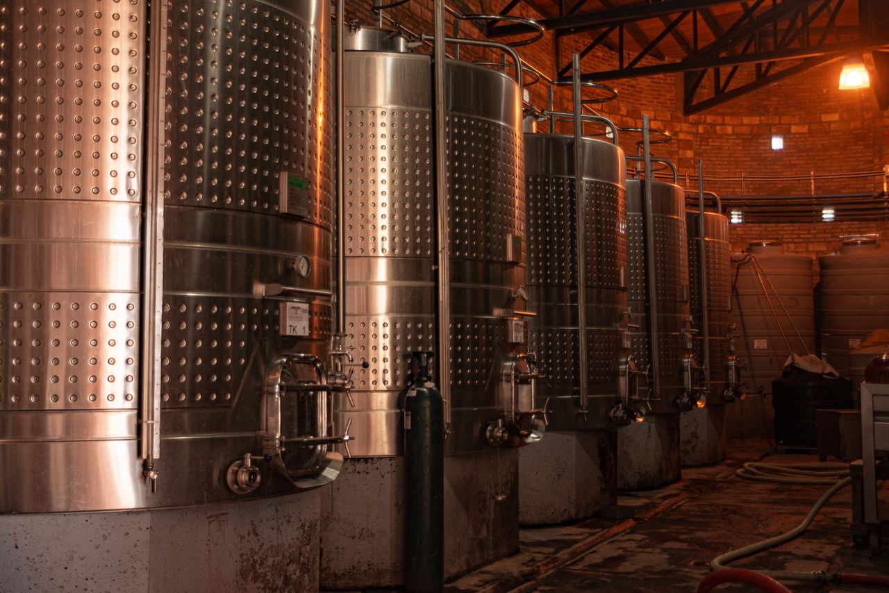 Crafting Captivating Headlines: Your awesome post title goes here Row of stainless steel tanks in an industrial plant showcasing modern production technology.